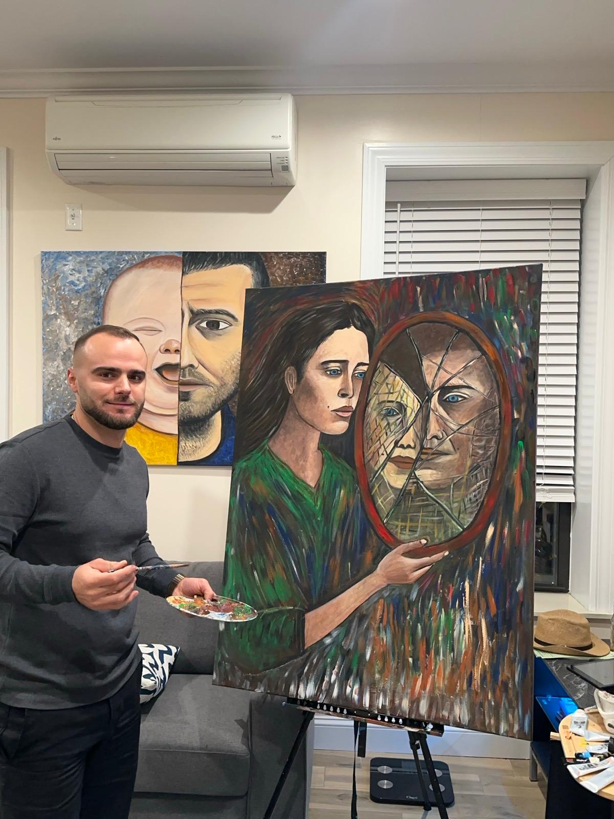 Drilon Malvataj holding painting
